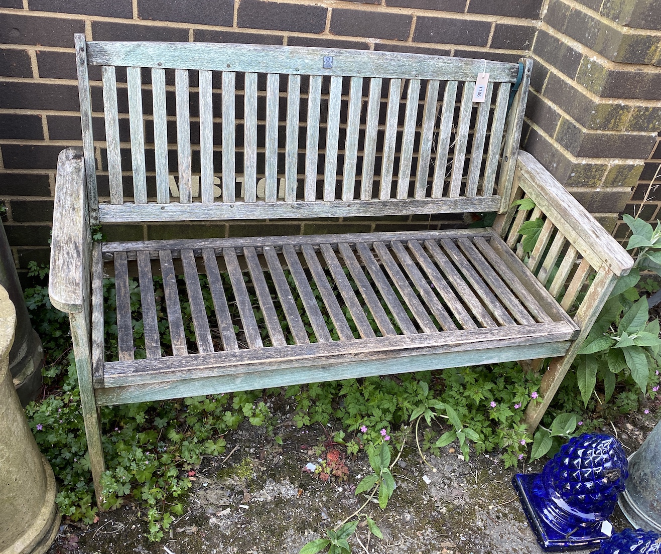 A weathered teak garden bench width, 118cm, height 88cm